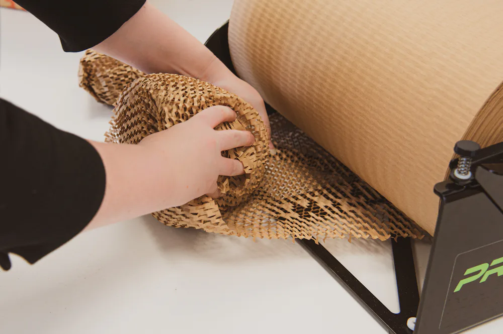 A person wrapping an item in Hexcel wrap