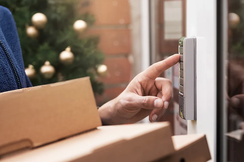 Evri courier ringing a doorbell at Christmas