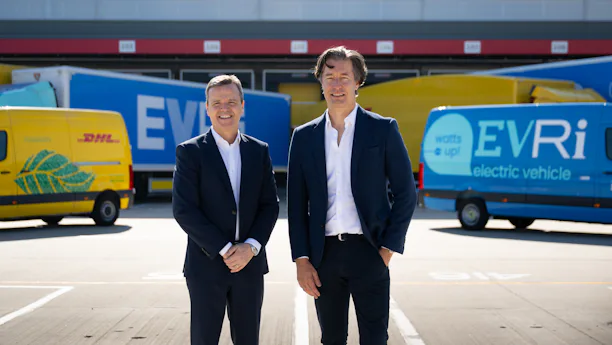 Martijn de Lange, CEO of Evri, with Pablo Ciano, CEO of DHL eCommerce in front of Evri and DHL vehicles
