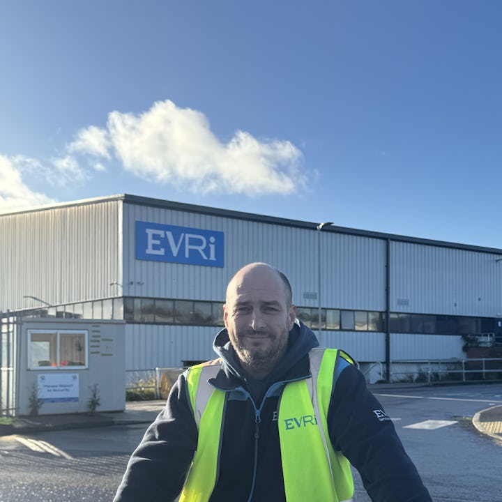 A photo of Evri courier, Michael McMullen, in uniform at an Evri depot