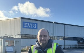 A photo of Evri courier, Michael McMullen, in uniform at an Evri depot