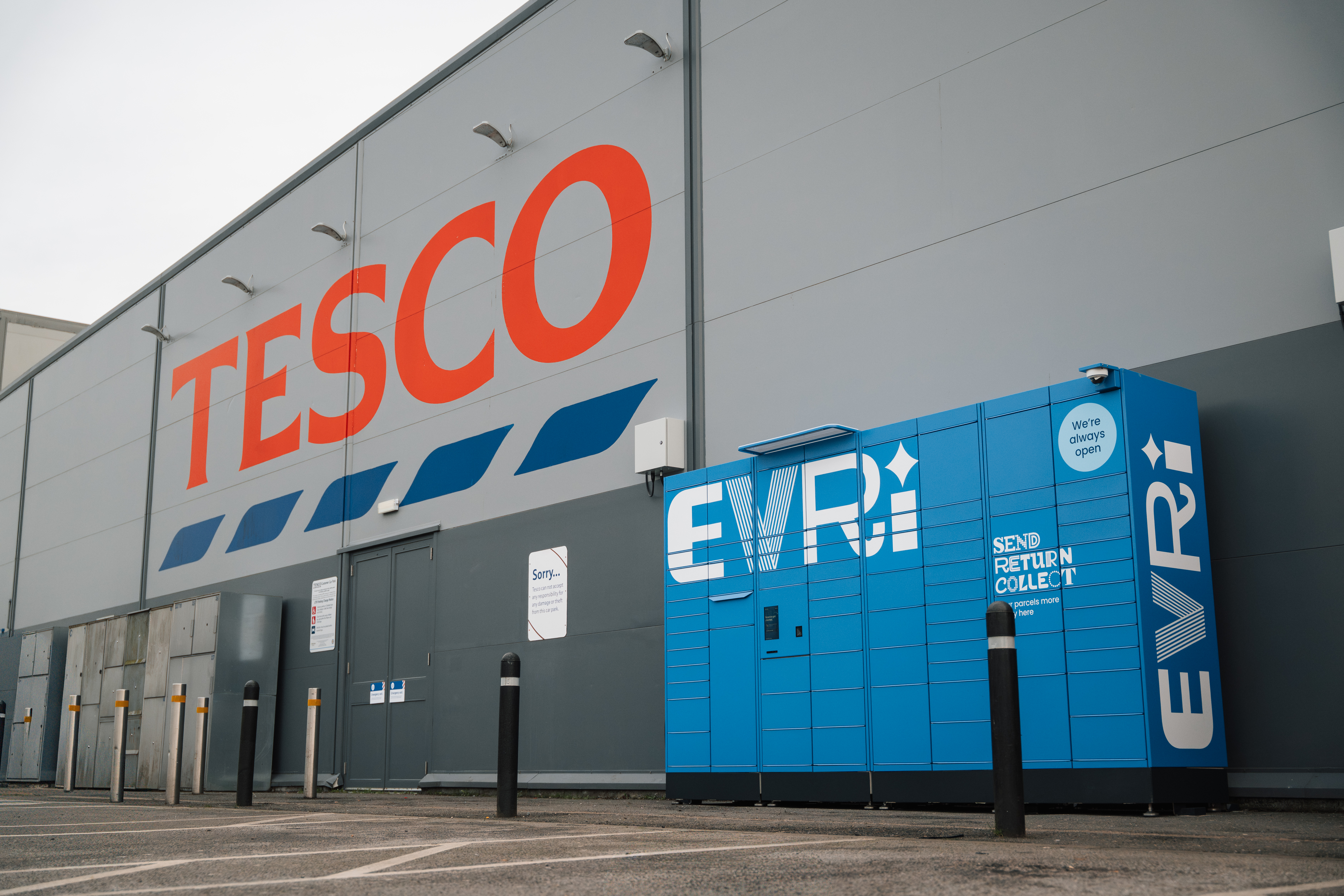 A blue Evri parcel locker outside a Tesco store