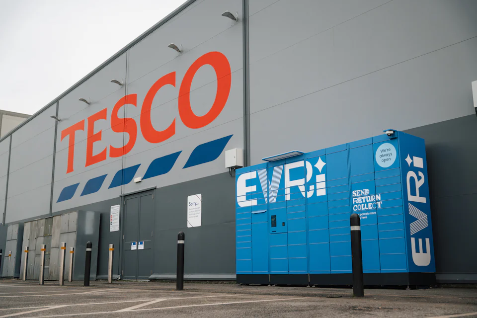 A blue Evri parcel locker outside a Tesco store