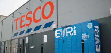 A blue Evri parcel locker outside a Tesco store