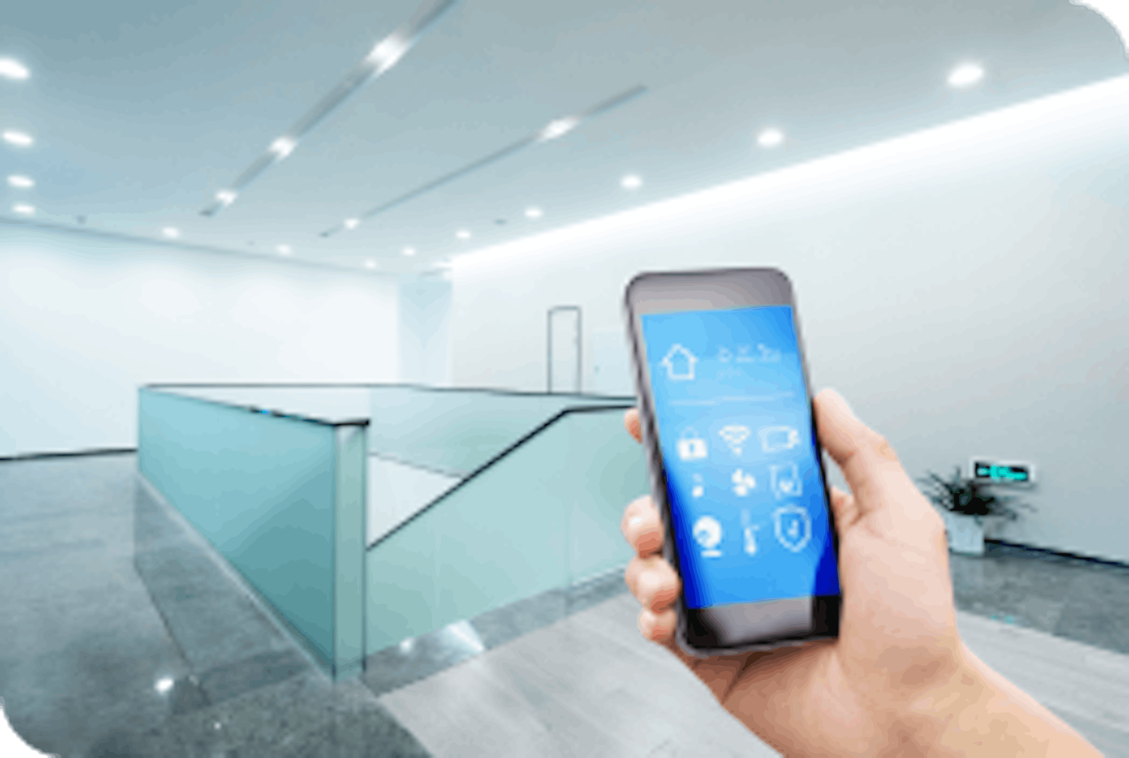 Hand holding a smartphone with an integrated security app in a clean modern building 