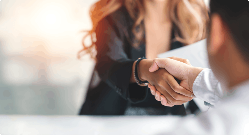 Business woman with blond long hair shaking hands with a client 
