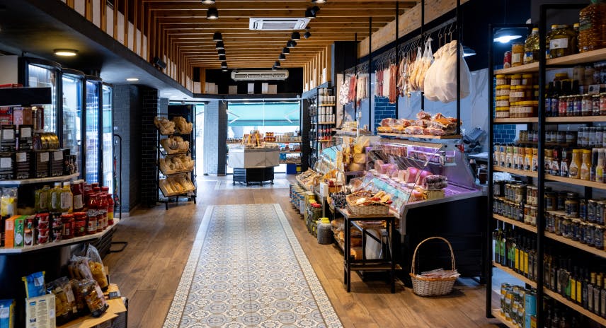 Photo of an empty cashierless grocery store with a lot of goods on display, ready to be grabbed by customers