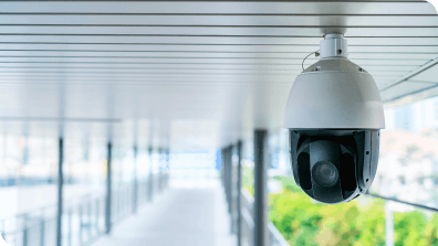 camera surveillance pointed at empty hallway