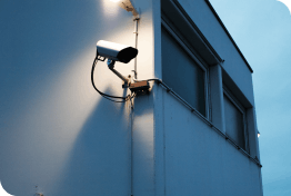 video surveillance camera mounted on business wall