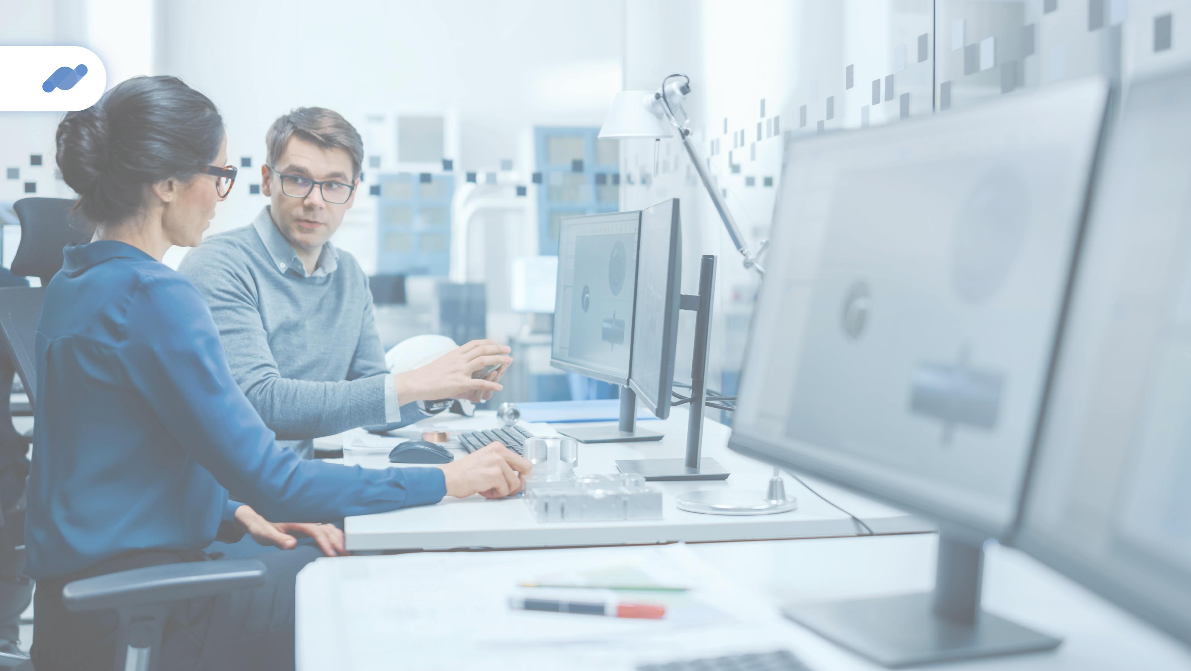 workers discussing in front of computer