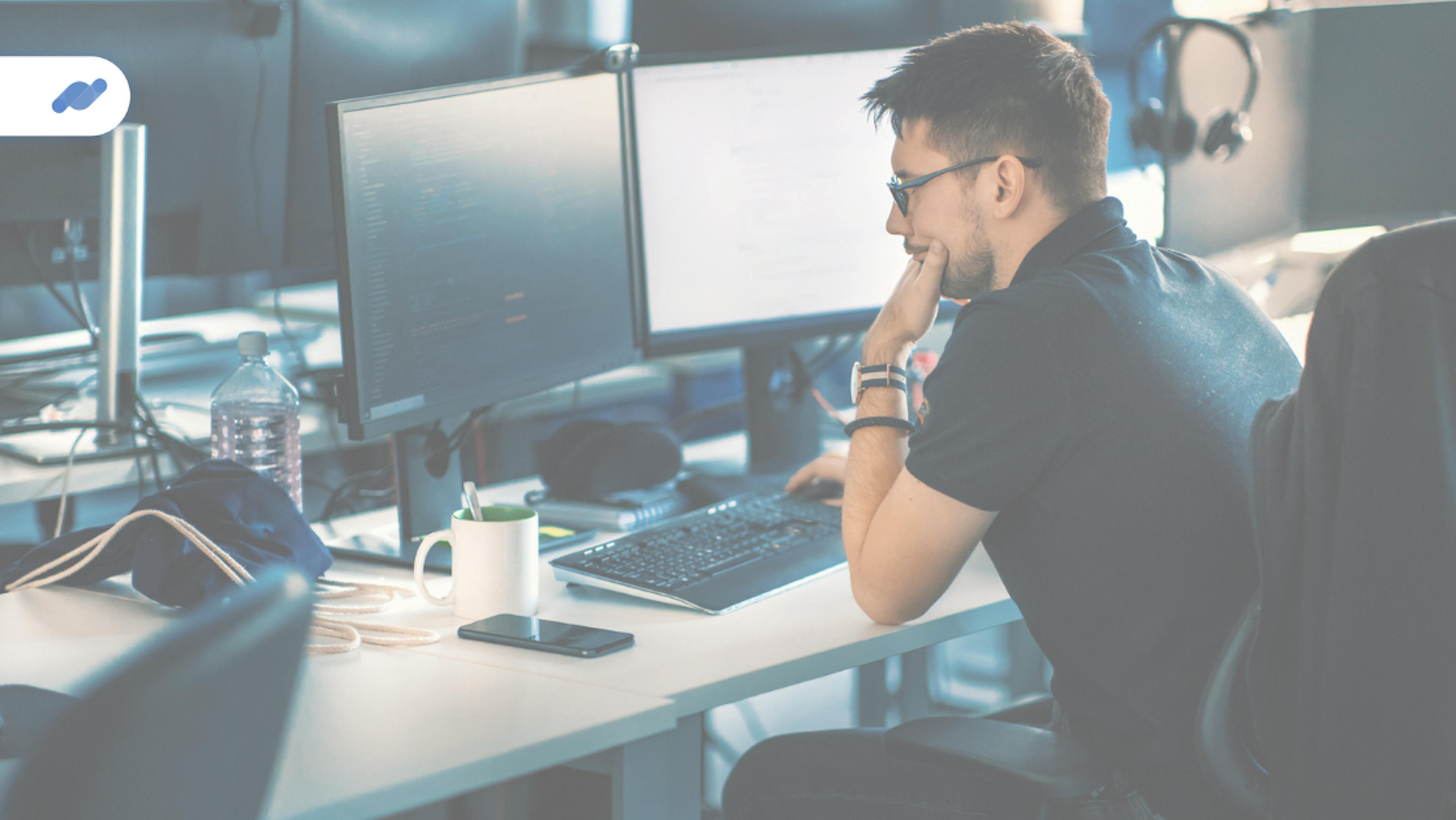 man working in front of computer evalink dev