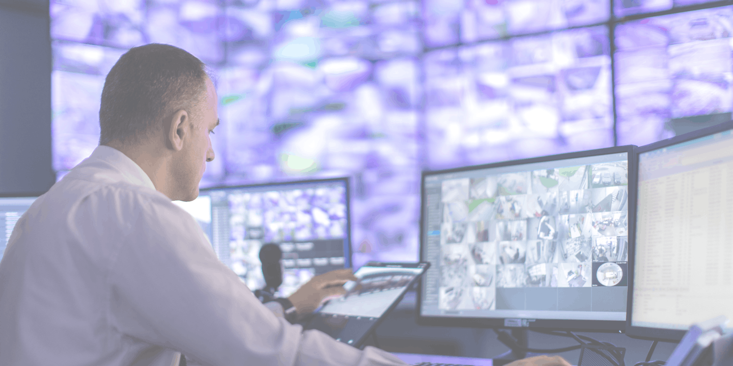 Operator looking at screen video surveillance center