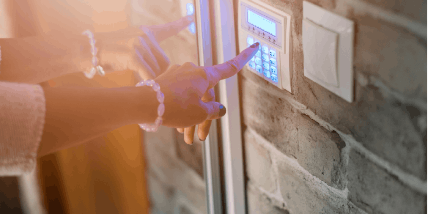 woman setting up an alarm panel