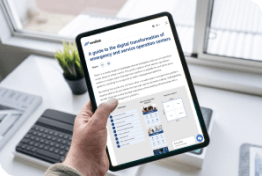 Someone reading the guide to the digital transformation of emergency and service operation centers on a tablet