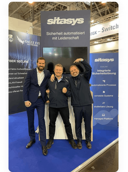 Lukas Kaiser, Peter Monte and Robbert Vrolijk from Sitasys AG pose with a big smile for a photo at the "Security Essen" event