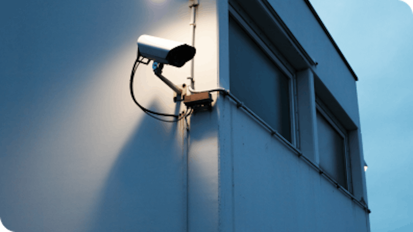 video surveillance camera mounted on business wall