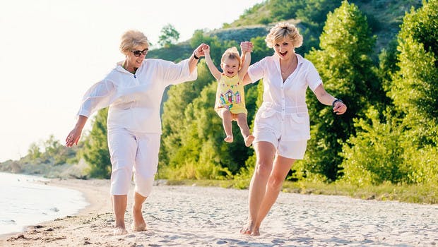 Multi-generational travellers on the beach