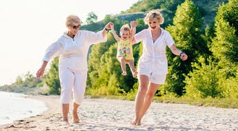 Multi-generational travellers on the beach