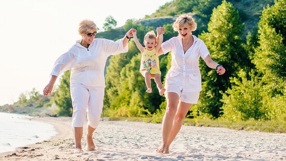 Multi-generational travellers on the beach