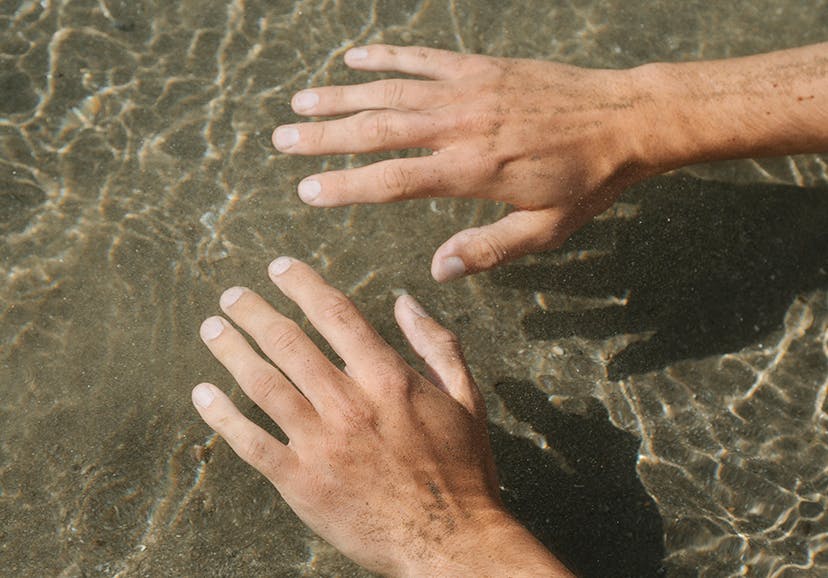 hands in the water