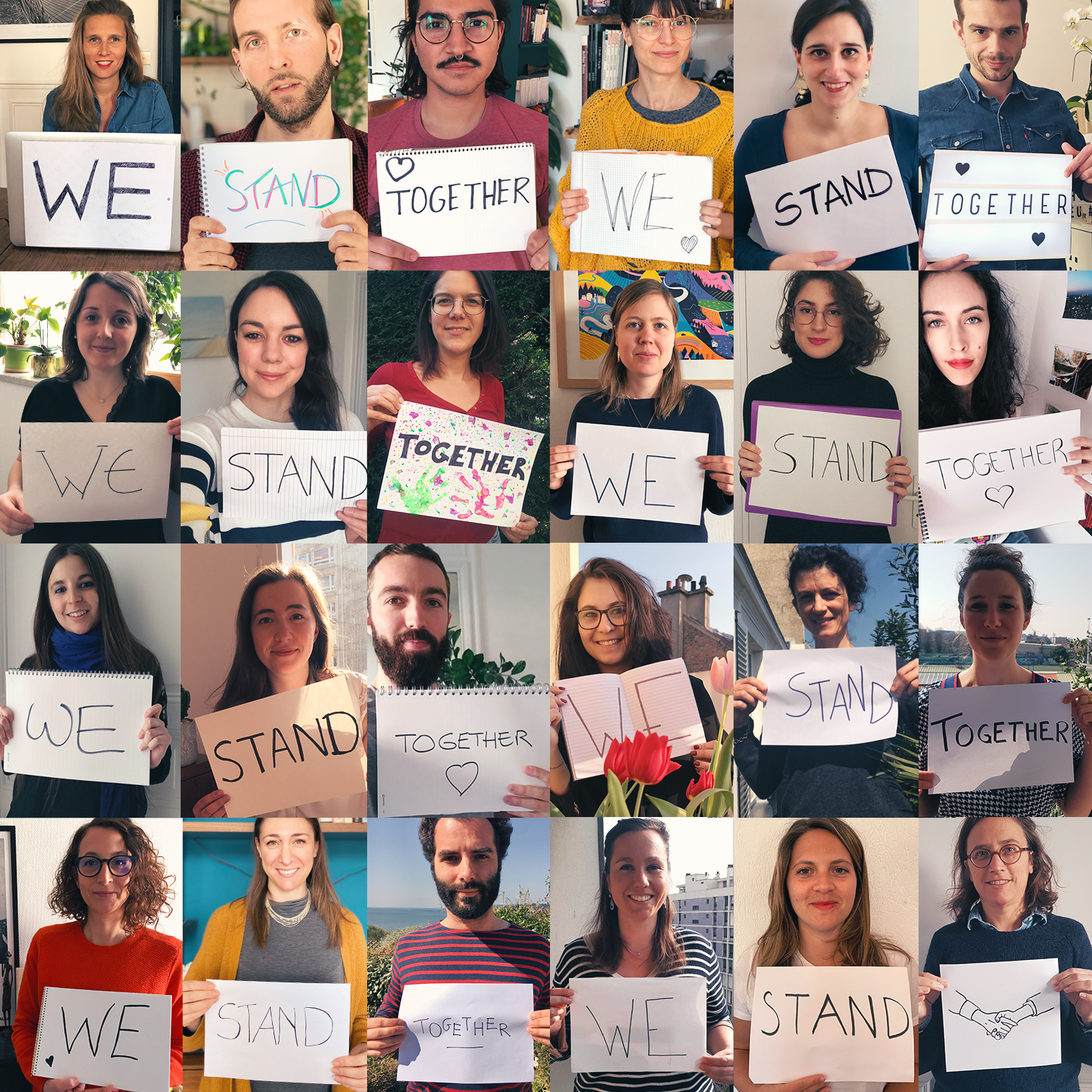 Evaneossiens portant des pancartes sur lesquelles sont inscits les mots "We Stand Together"