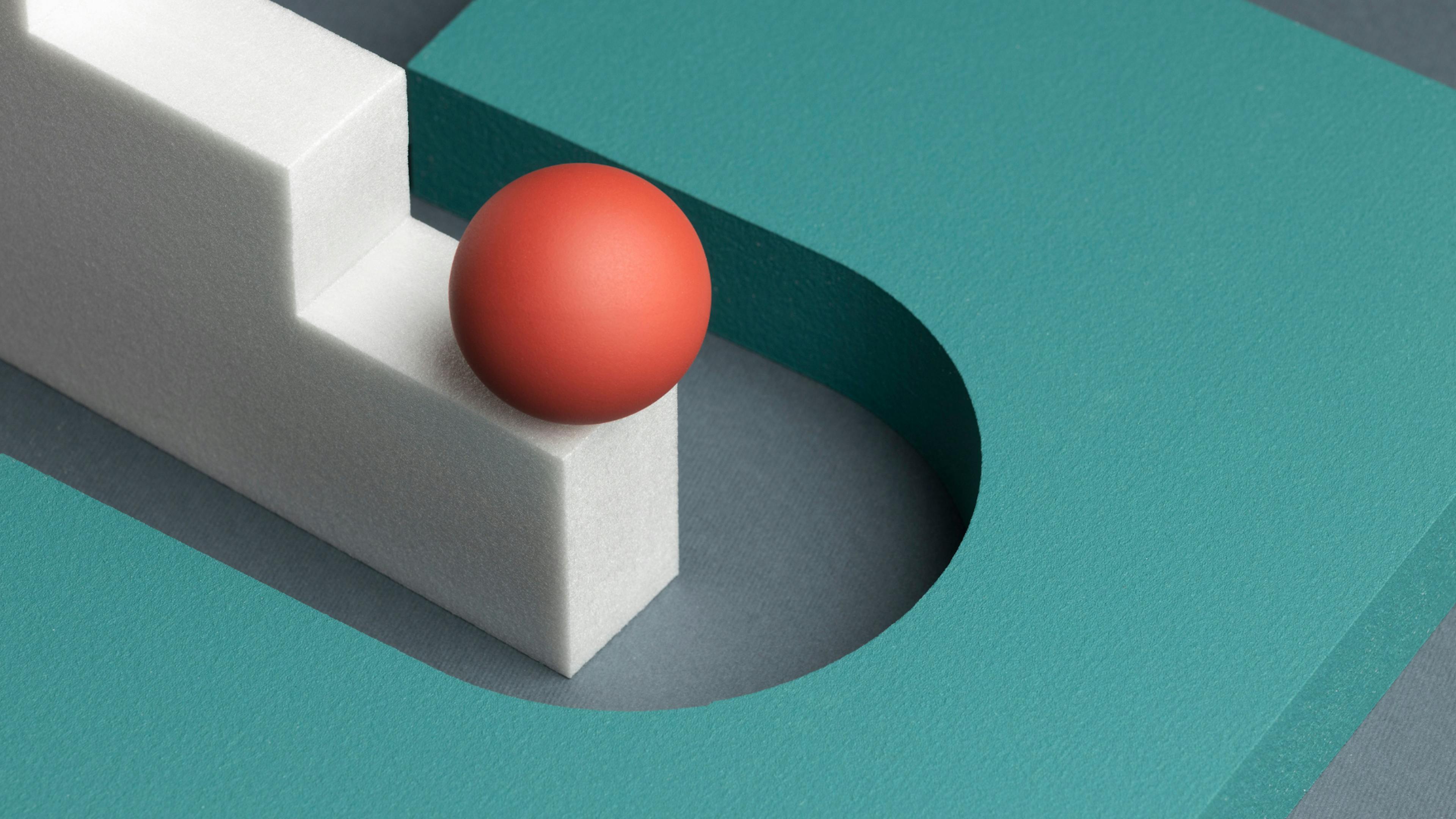 Red dodgeball at the edge of the platform