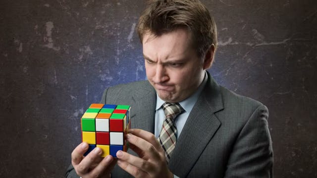 Man trying to solve puzzle