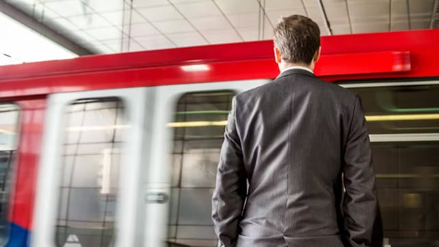 Man standing in the train station