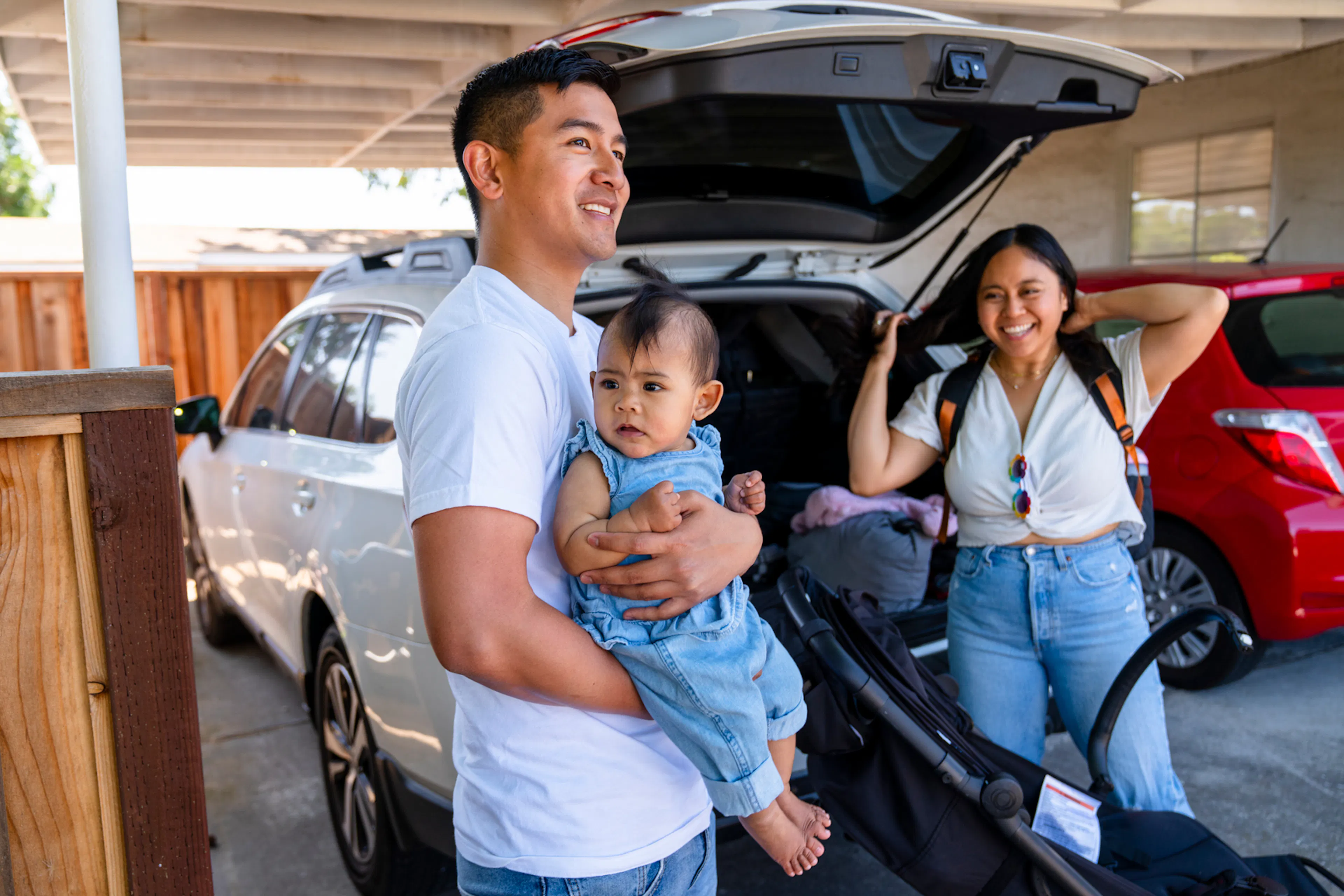 Young family preparing for a family outing