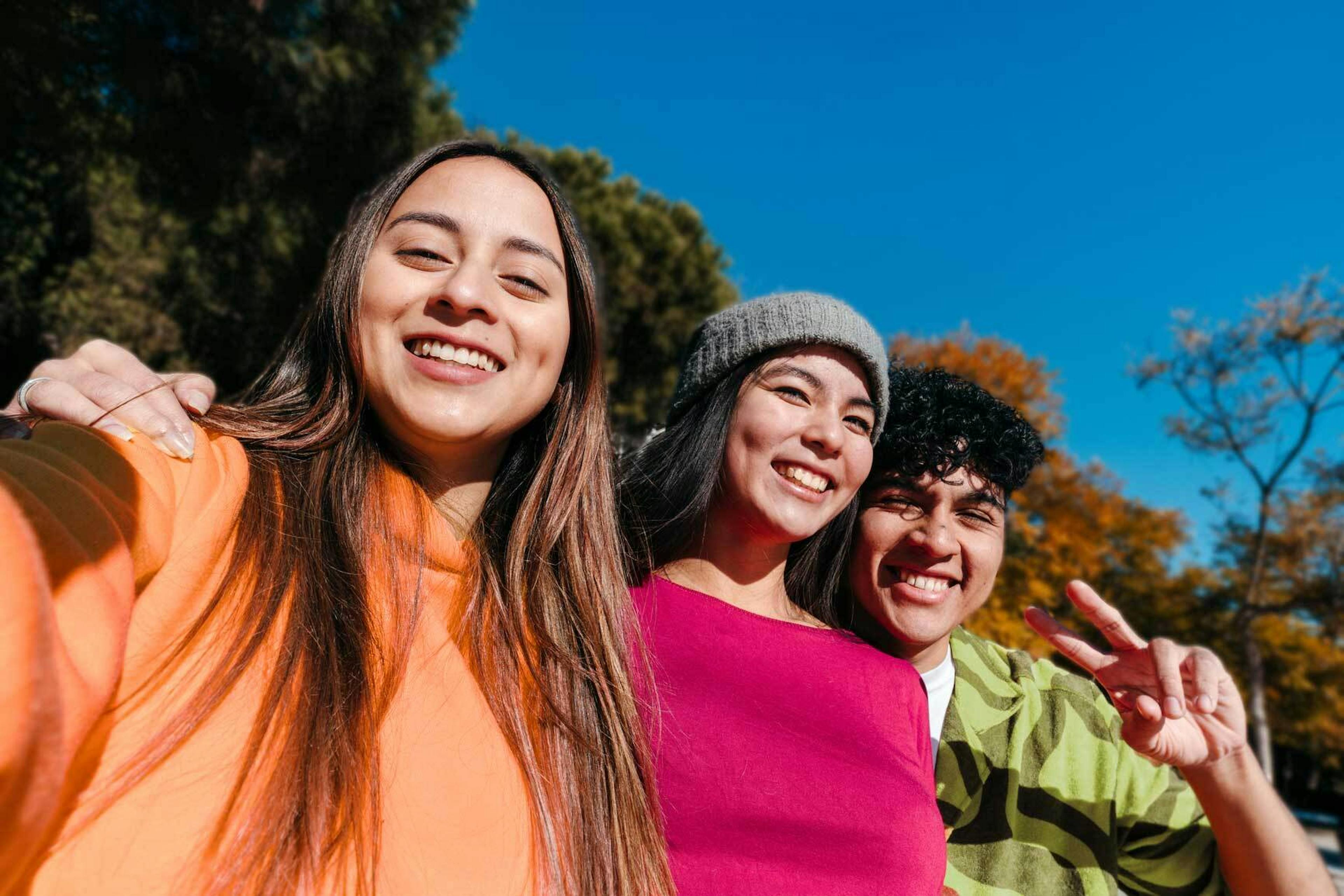 Three Gen Z friends enjoying the weather together.