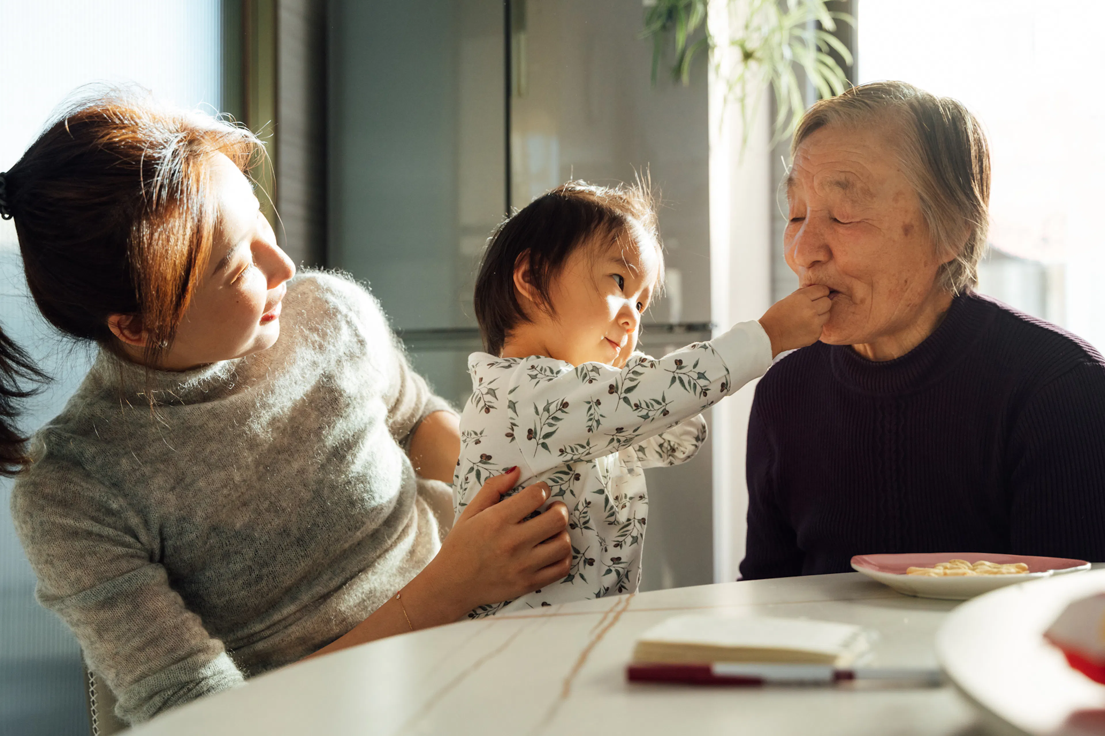 Three generations gathered around the dining table