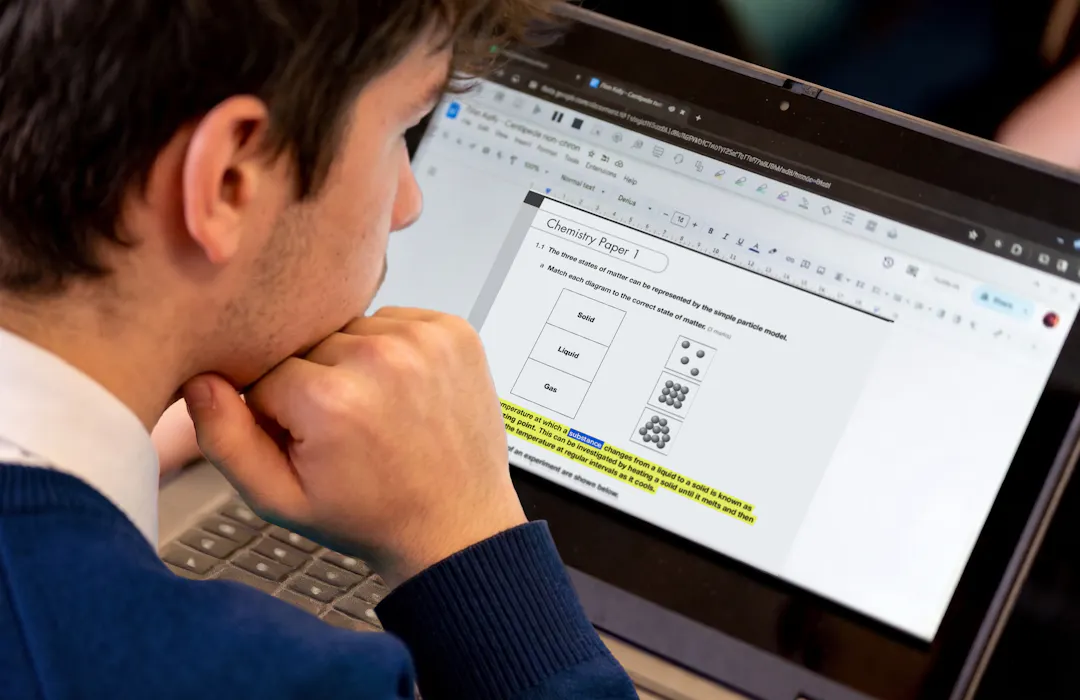 Image of a student working on an exam on a laptop.