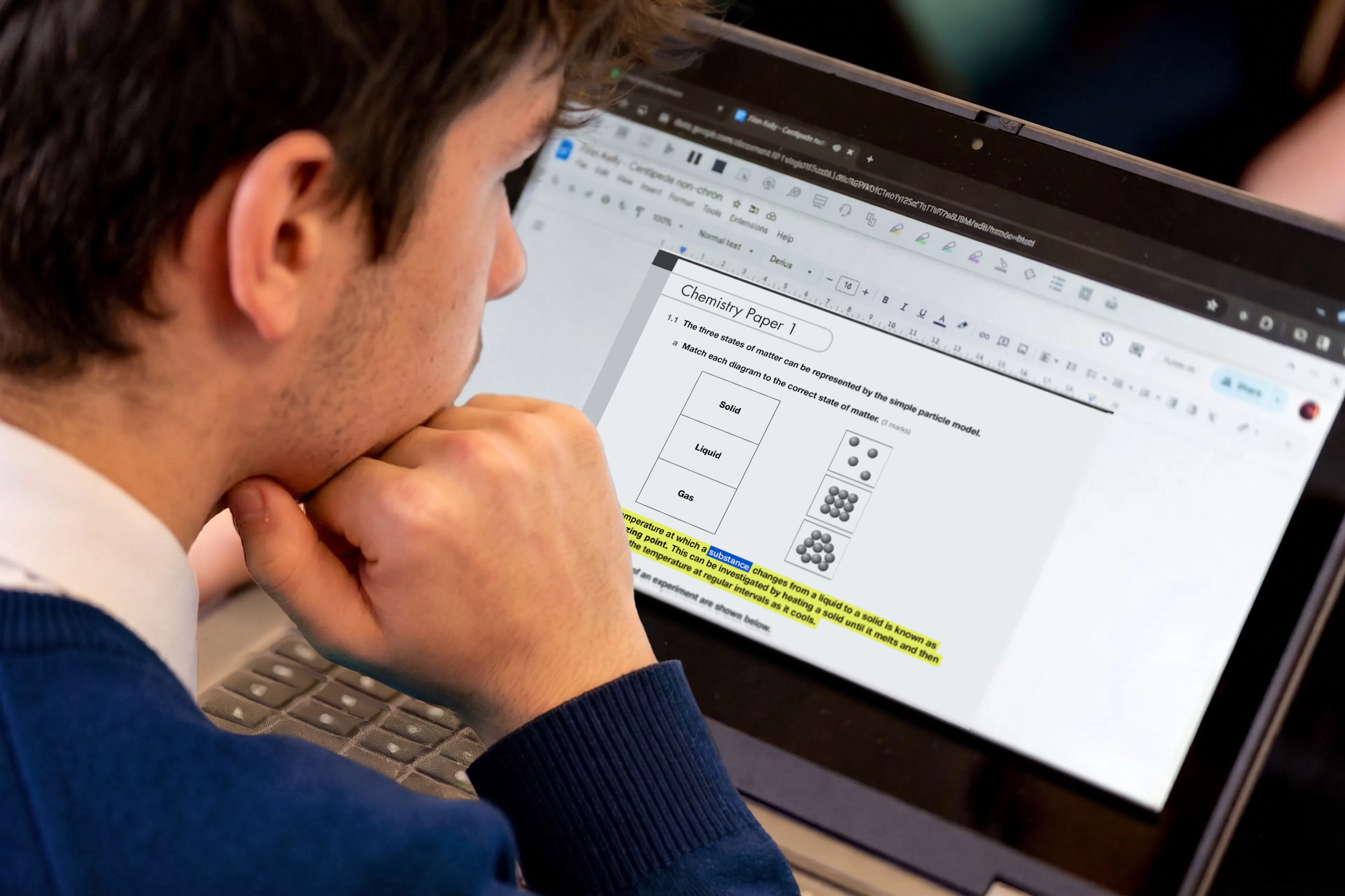 Image of a student working on an exam on a laptop.