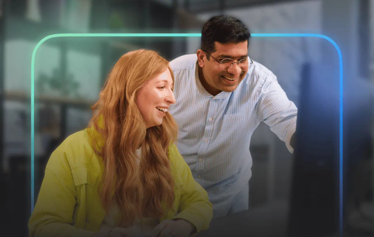 Employees smiling and working together at a company event workshop