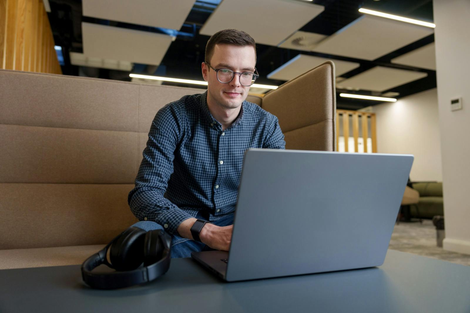 An employee using a laptop in the workplace