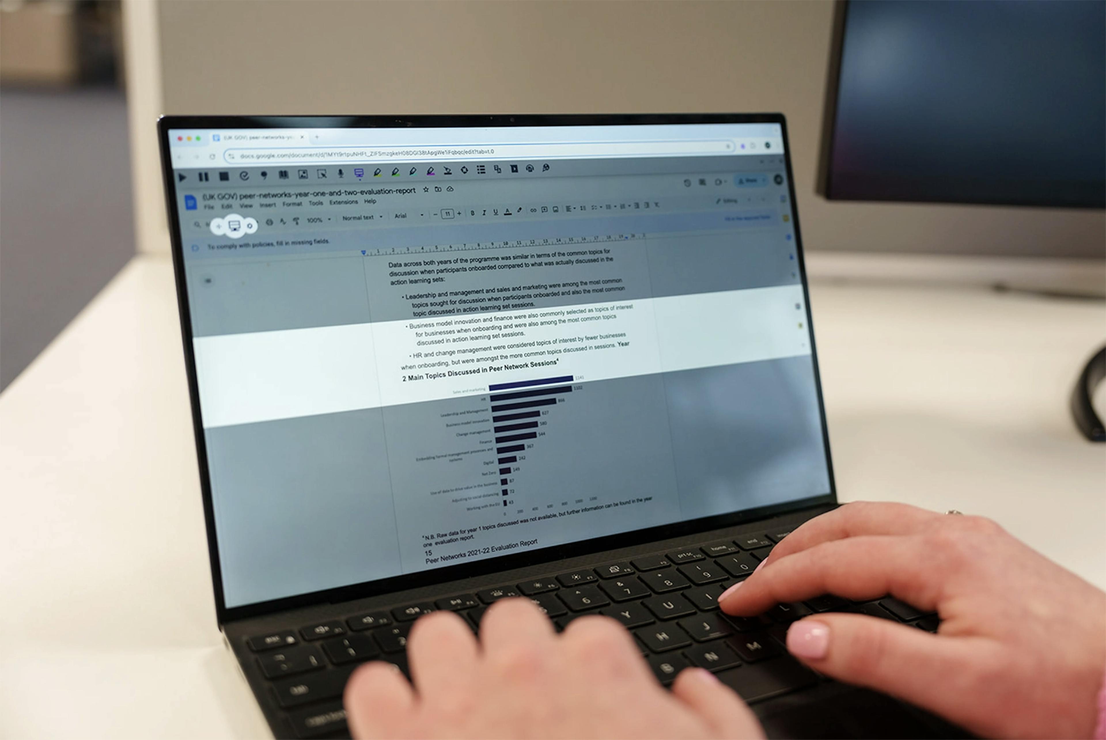 An employee using our Read&Write Screen Masking feature on a laptop