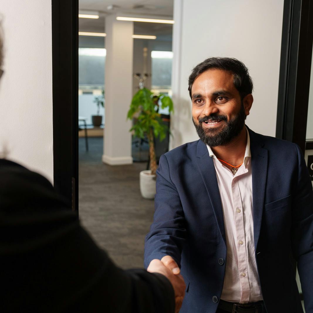 A job candidate shaking hands with an Everway team member