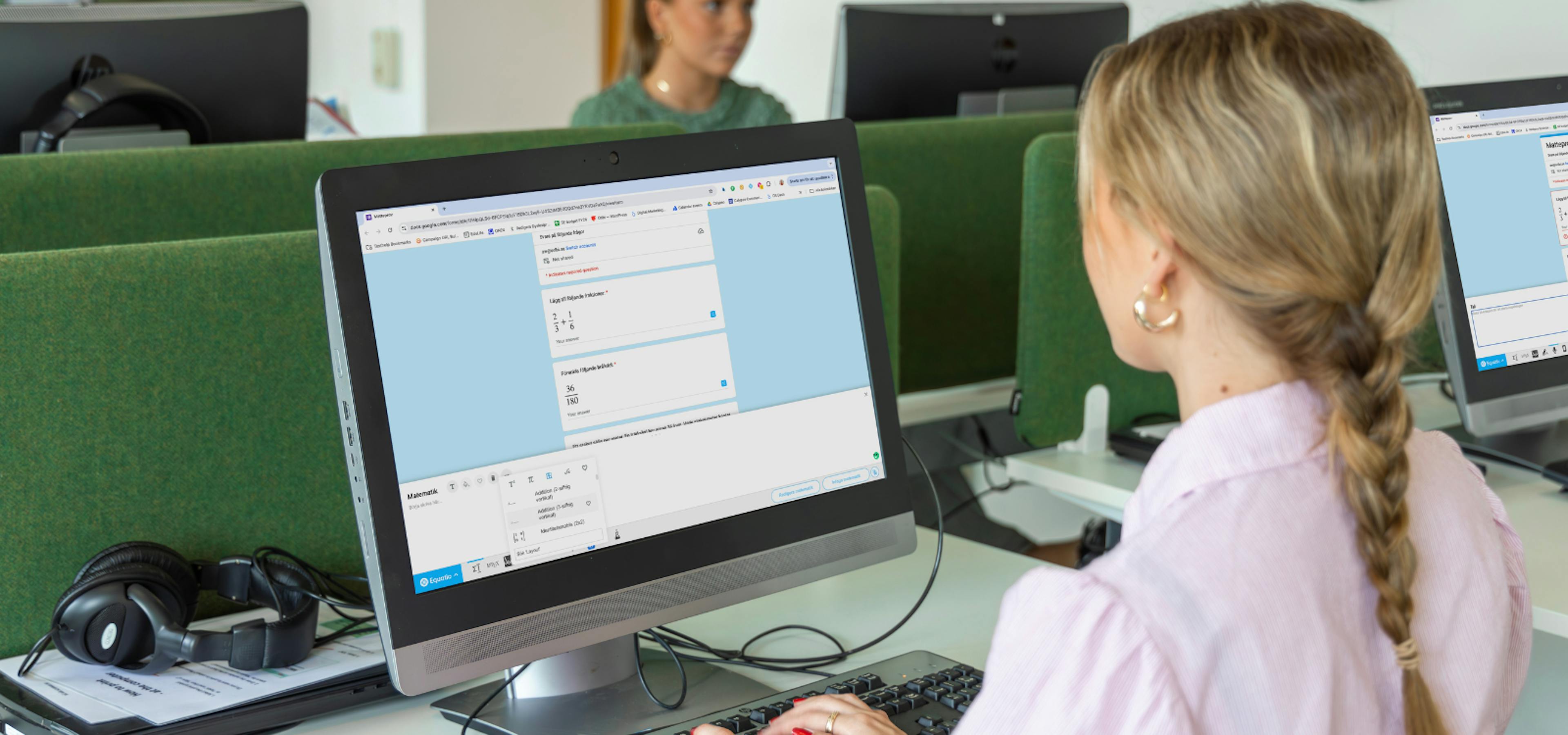 someone using equatio form builder on a computer in a lab