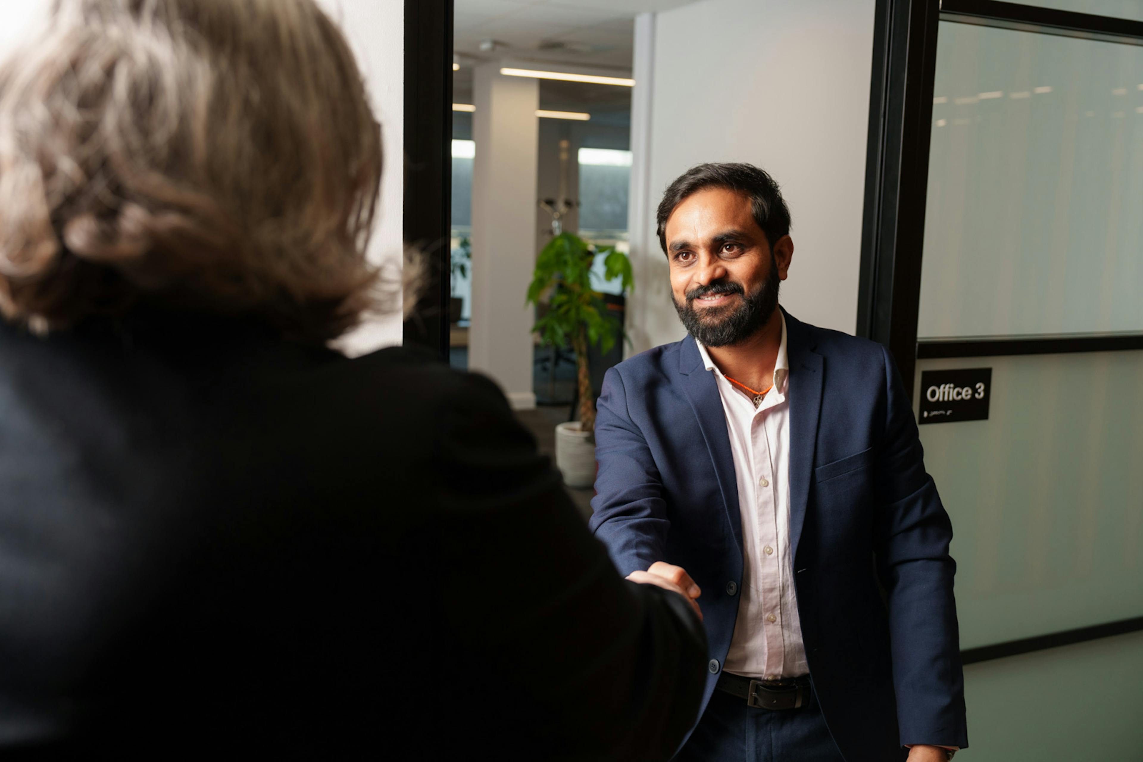 a man shaking someone's hand