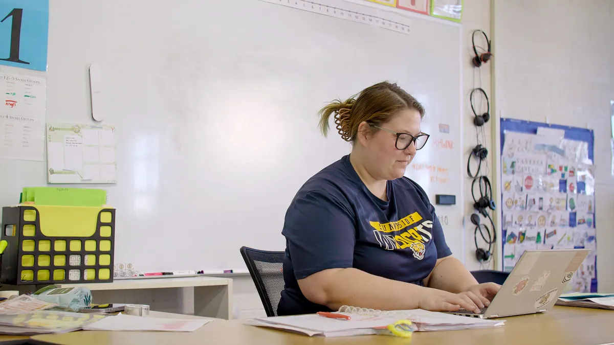 Teacher working at desk