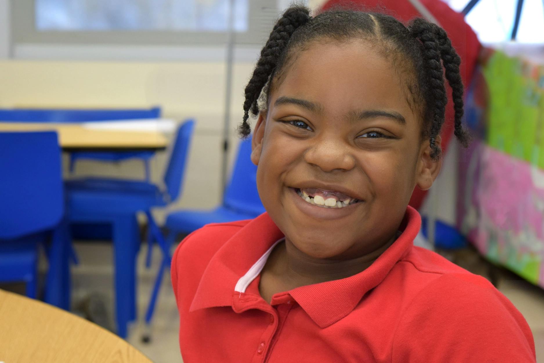 A student smiling in the classroom