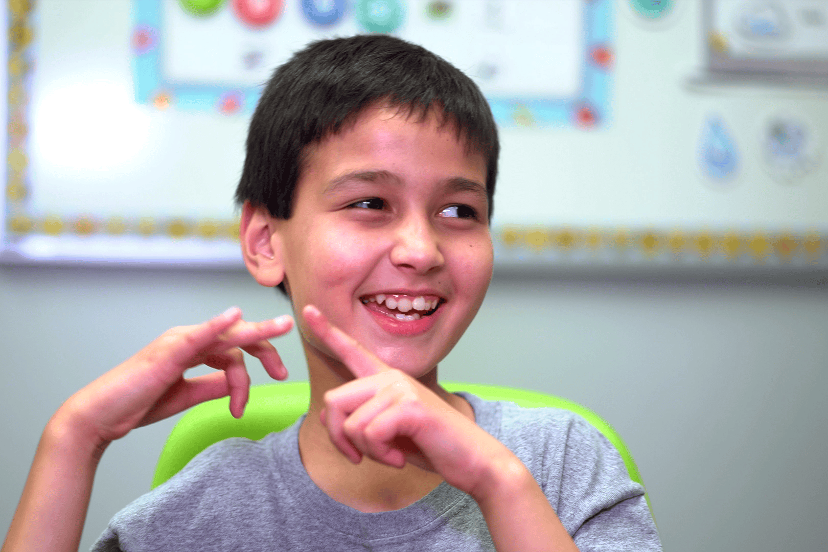 Close up of a student smiling while in school