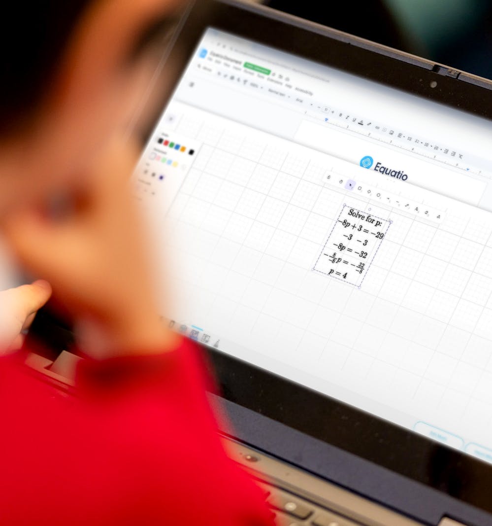 Student using equation on a laptop