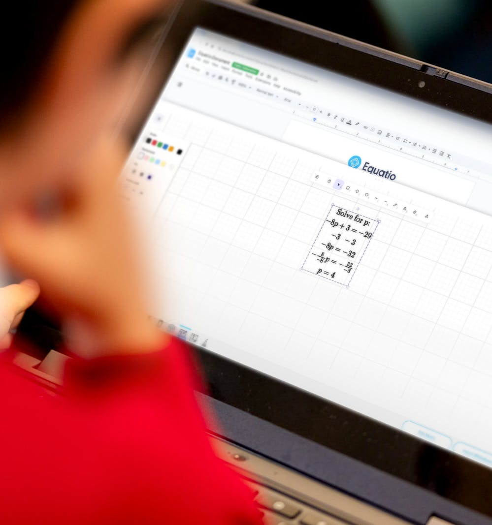 Student using equation on a laptop