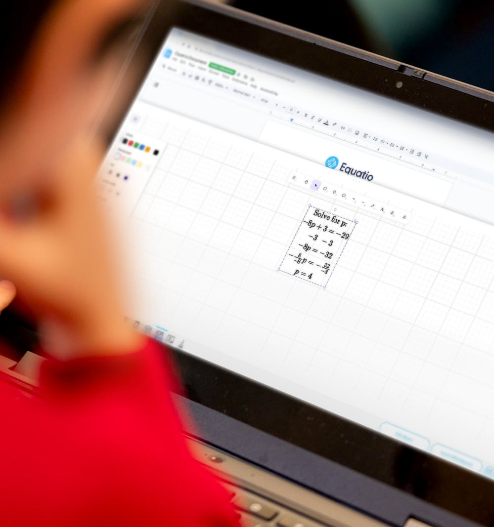 Student using equation on a laptop