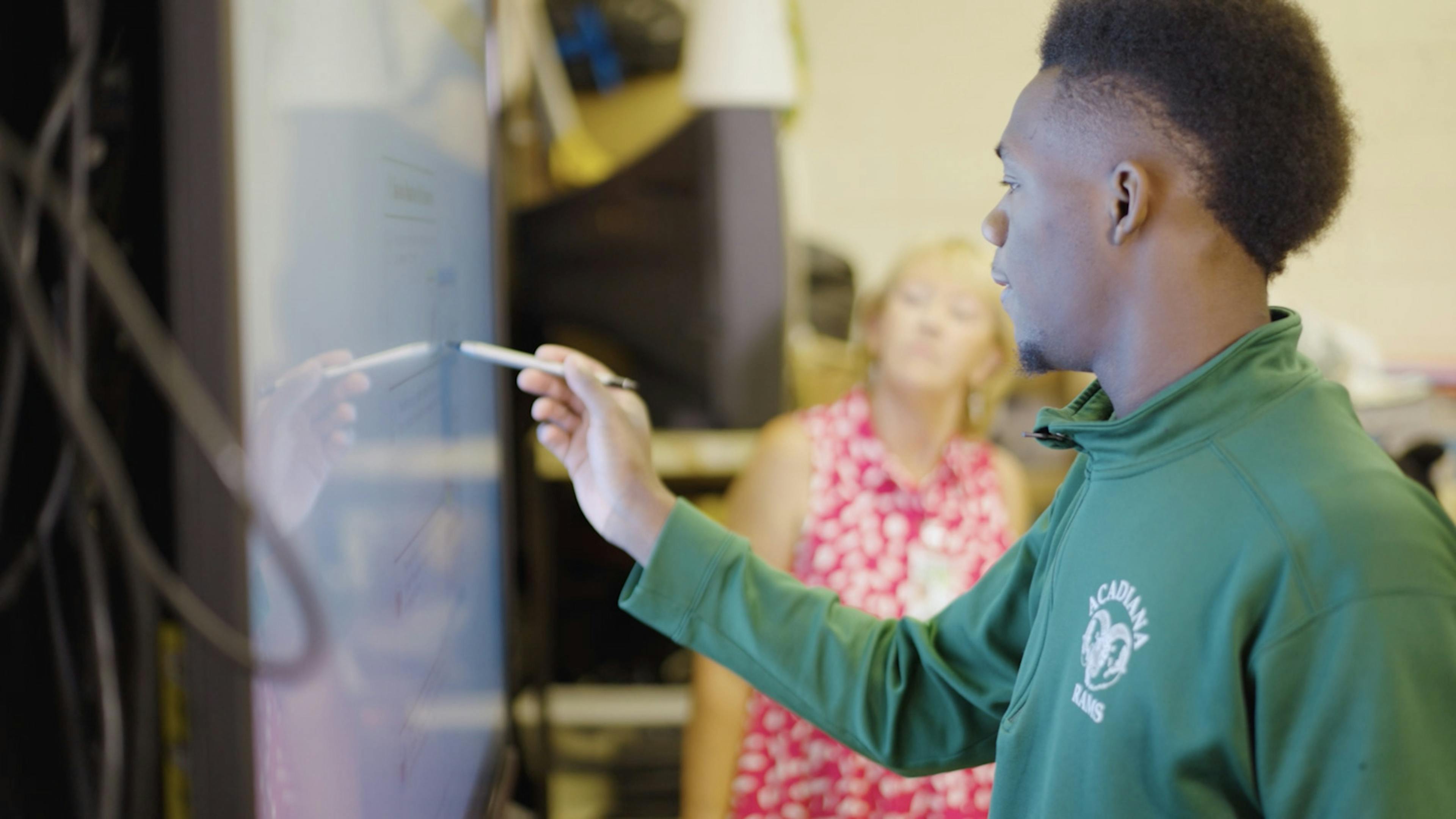 Student using digital whiteboard