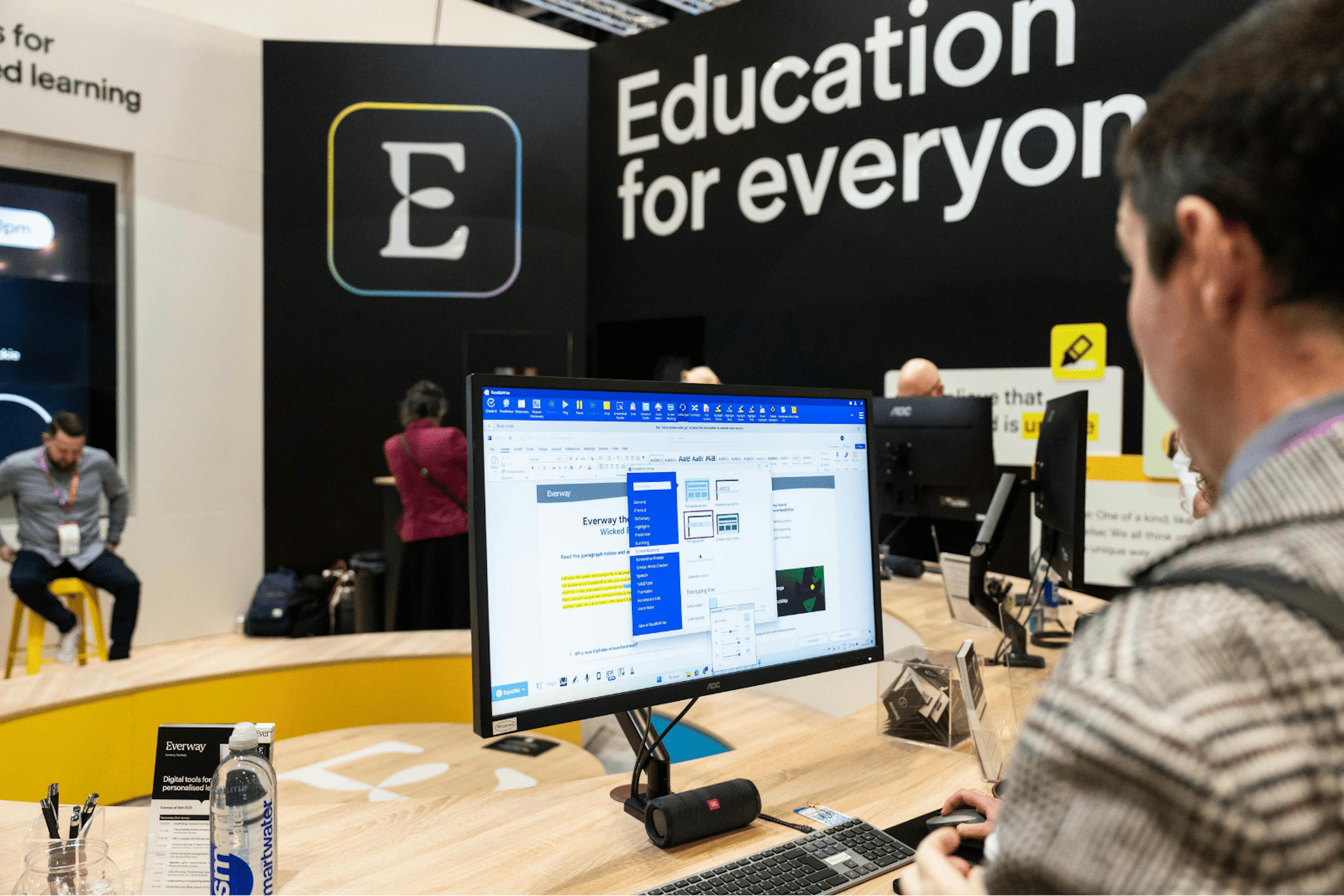 Man looking at a screen at an event