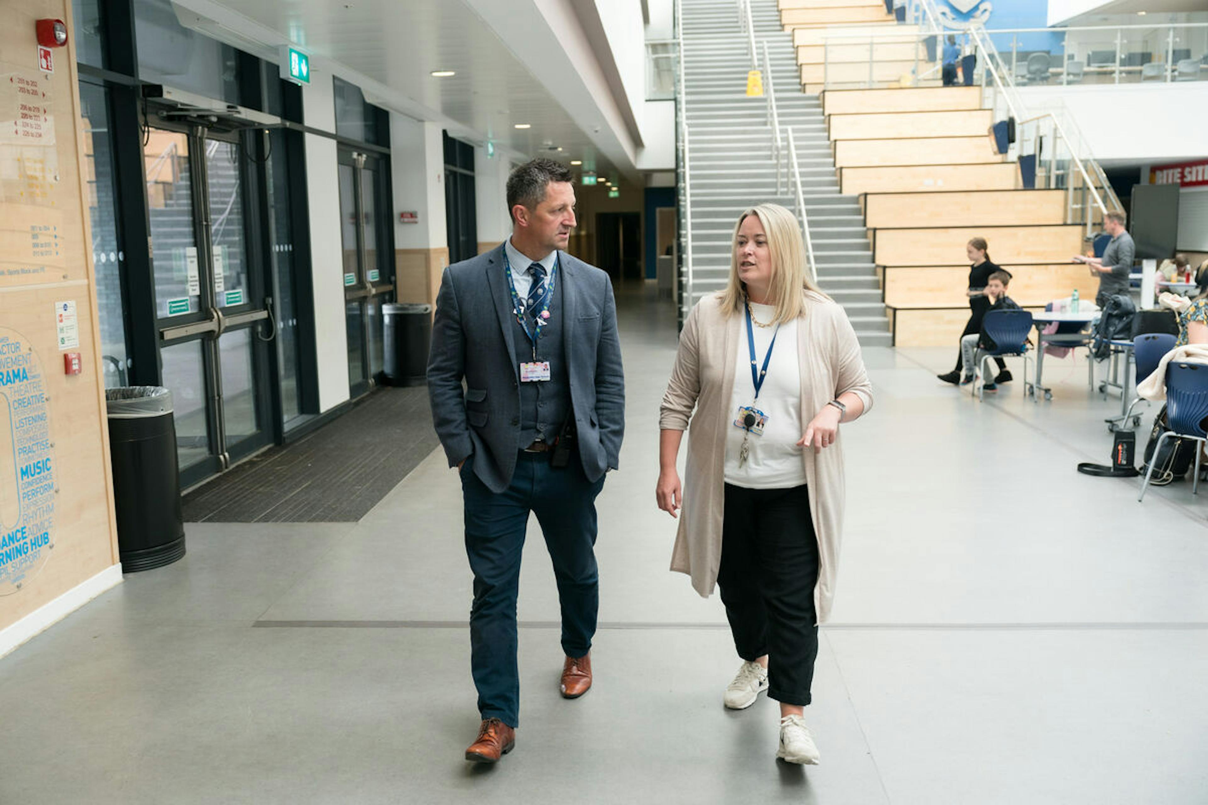 Educational leaders from Midlothian Schools walking in a hallway 