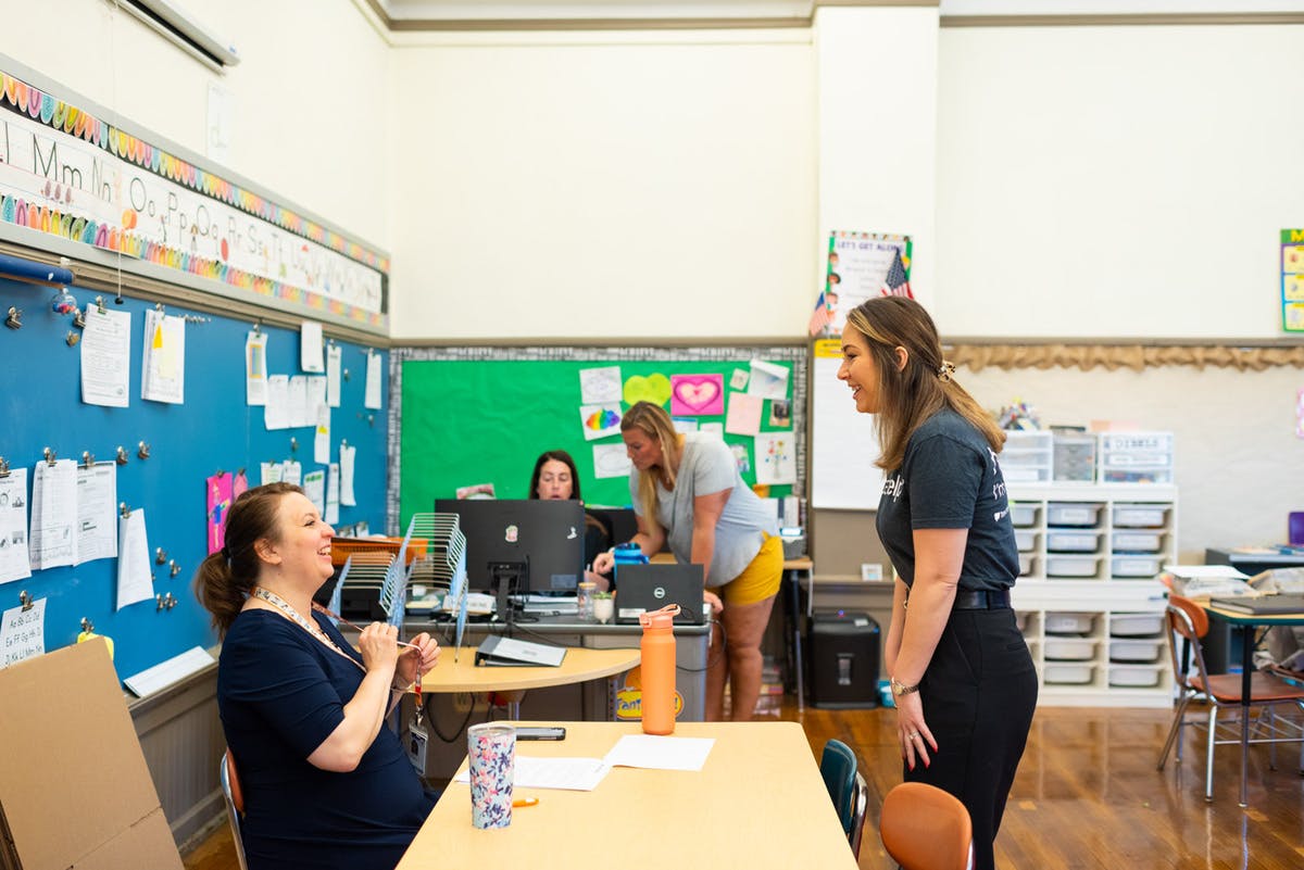 Educators talking in the classroom