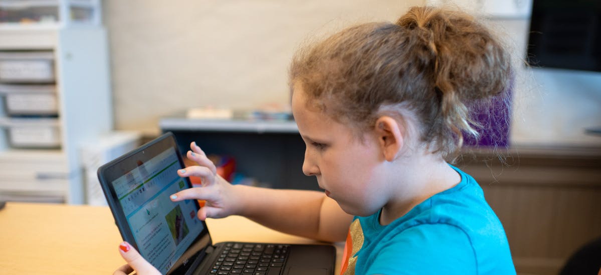 A student using a laptop